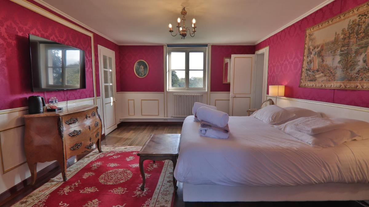 Un ou plusieurs lits dans un hébergement de l'établissement Chateau du boulay morin