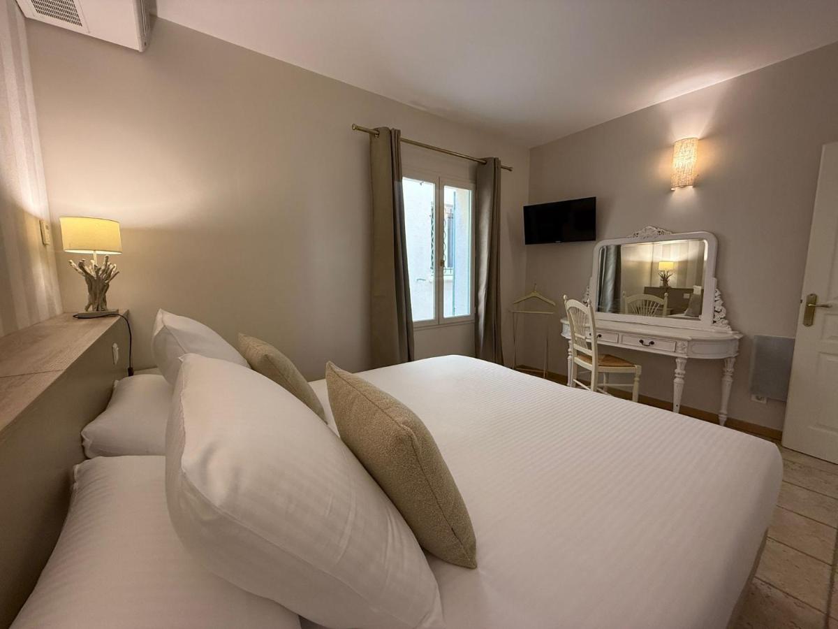 Un ou plusieurs lits dans un hébergement de l'établissement CÉRÈS - Boutique-Hôtel & Spa