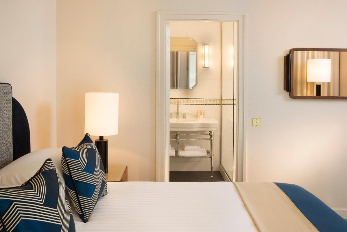 Un ou plusieurs lits dans un hébergement de l'établissement Le Tsuba Hotel