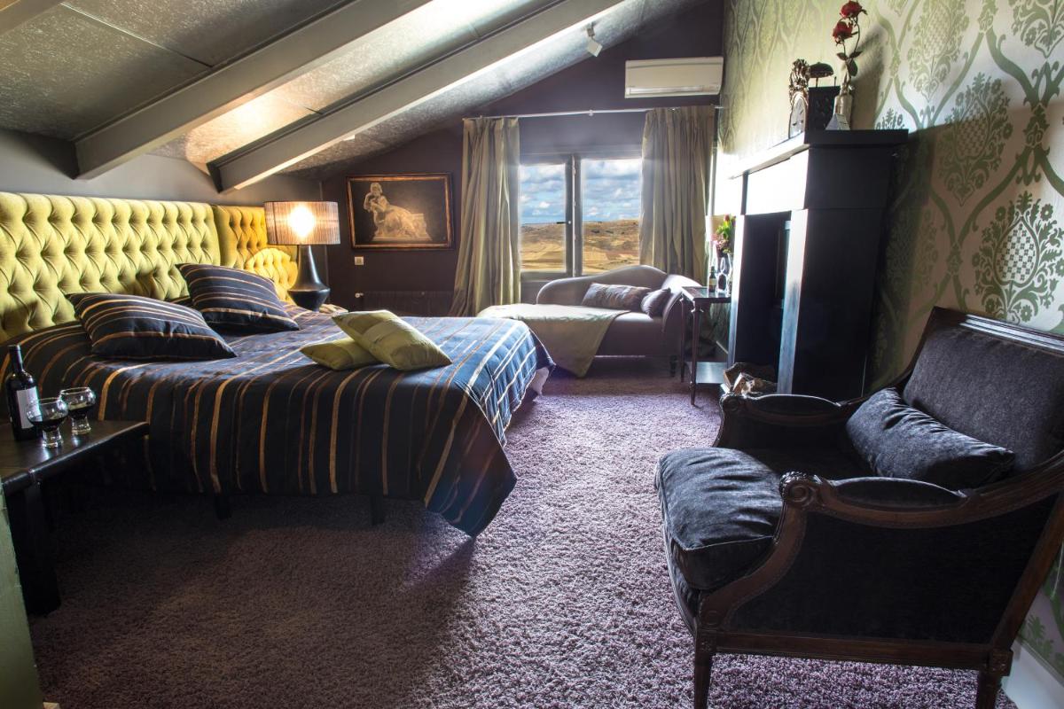 Cama o camas de una habitación en Hotel Cardamomo Sigüenza
