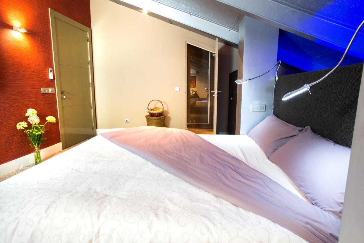 Cama o camas de una habitación en Hotel Cardamomo Sigüenza