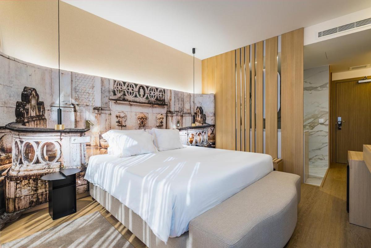 Uma cama ou camas num quarto em Lisotel - Hotel & Spa
