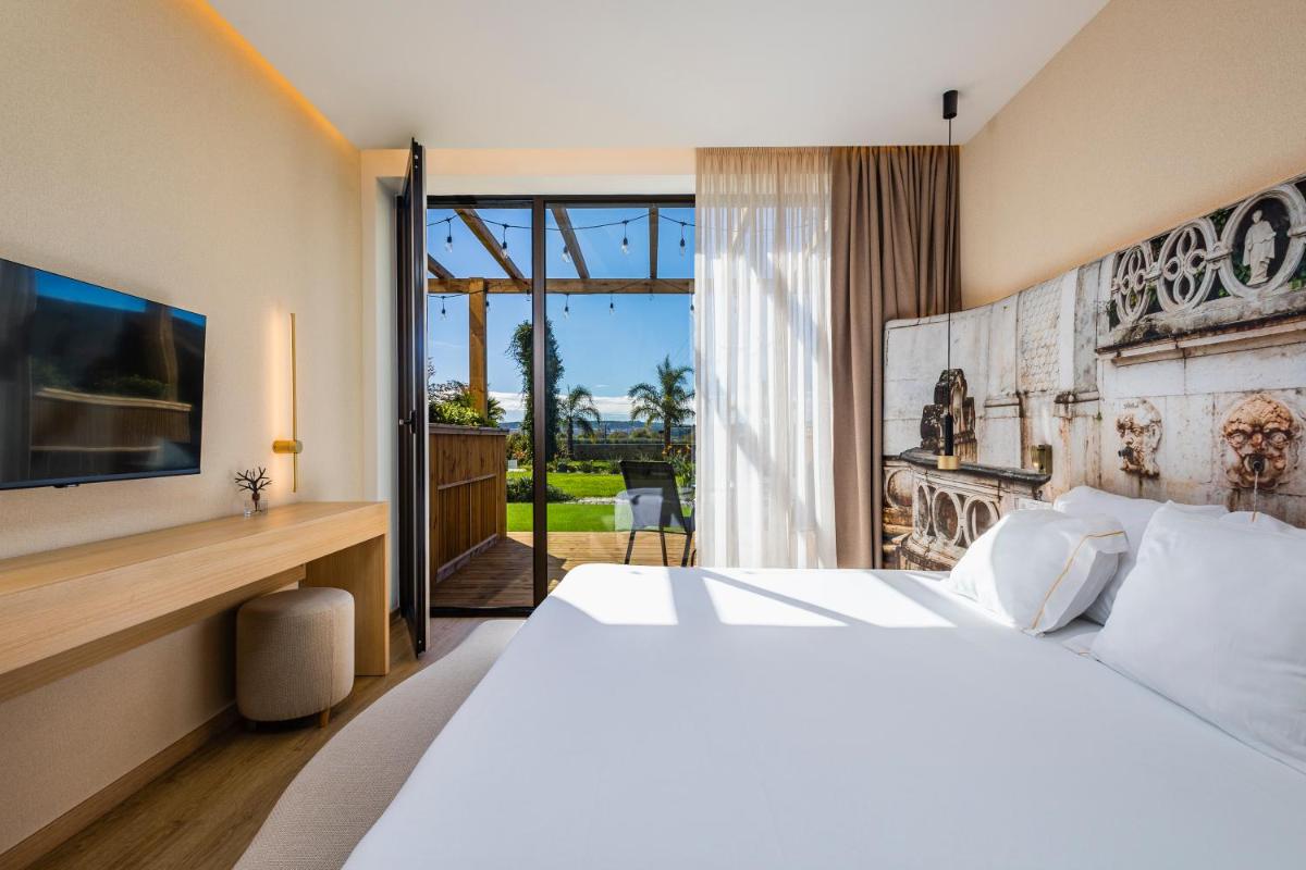 Uma cama ou camas num quarto em Lisotel - Hotel & Spa