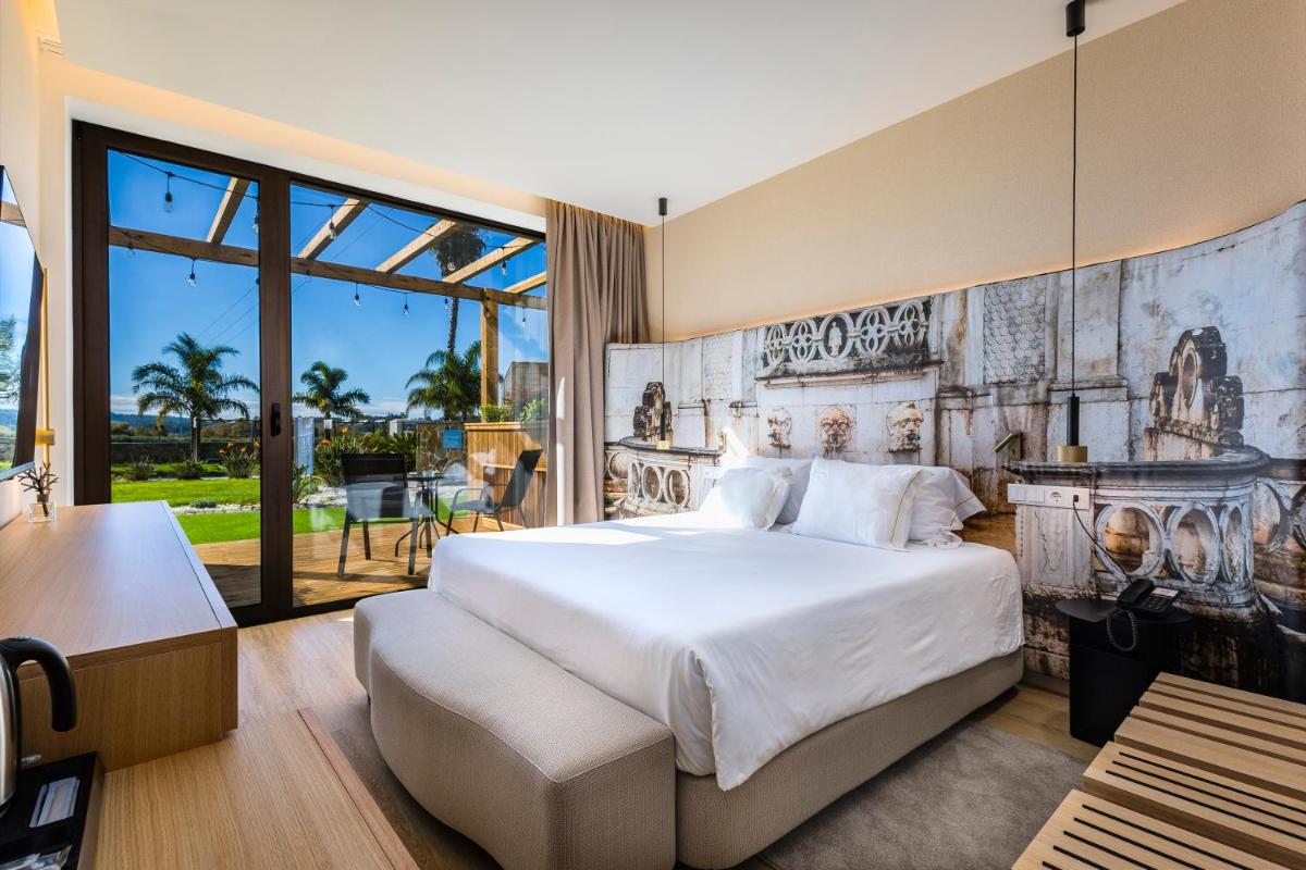 Uma cama ou camas num quarto em Lisotel - Hotel & Spa