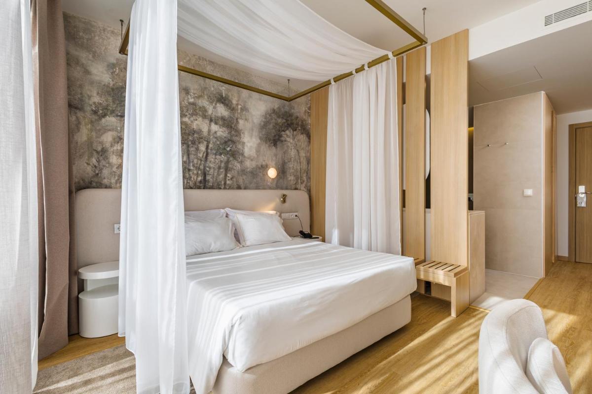 Uma cama ou camas num quarto em Lisotel - Hotel & Spa