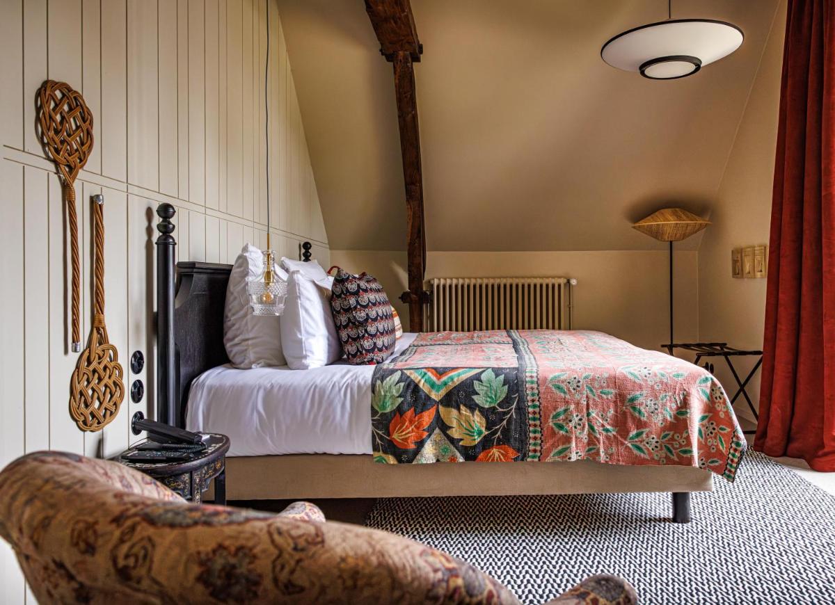 Un ou plusieurs lits dans un hébergement de l'établissement Domaine de Locguénolé & Spa - Relais & Chateaux