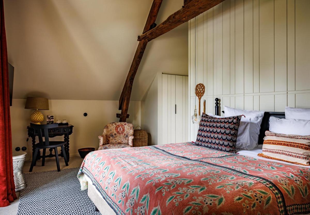 Un ou plusieurs lits dans un hébergement de l'établissement Domaine de Locguénolé & Spa - Relais & Chateaux