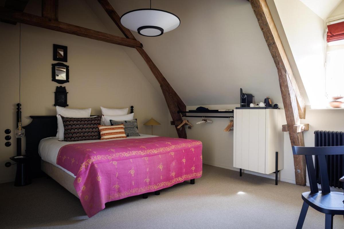 Un ou plusieurs lits dans un hébergement de l'établissement Domaine de Locguénolé & Spa - Relais & Chateaux