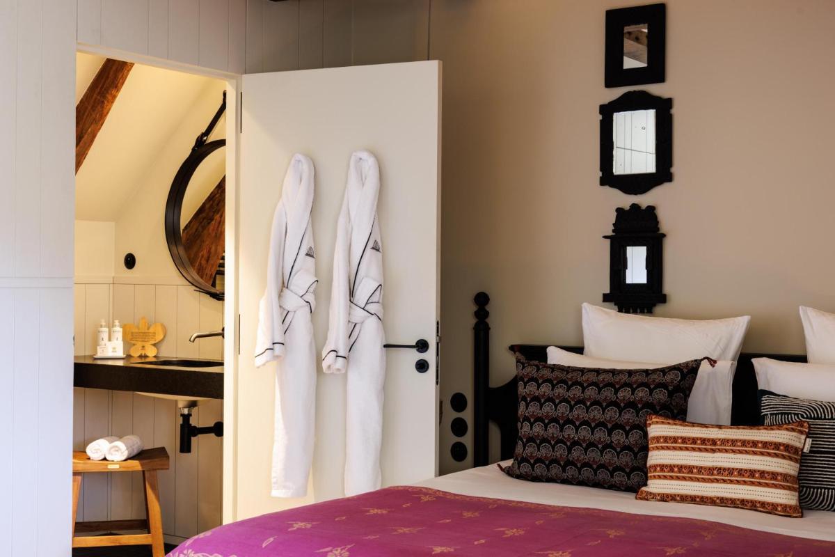 Un ou plusieurs lits dans un hébergement de l'établissement Domaine de Locguénolé & Spa - Relais & Chateaux