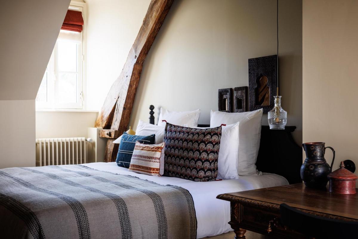 Un ou plusieurs lits dans un hébergement de l'établissement Domaine de Locguénolé & Spa - Relais & Chateaux