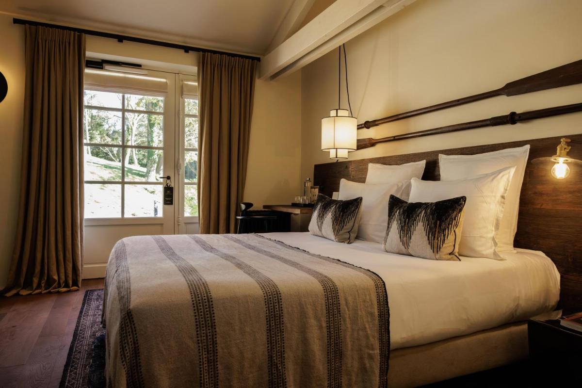 Un ou plusieurs lits dans un hébergement de l'établissement Domaine de Locguénolé & Spa - Relais & Chateaux