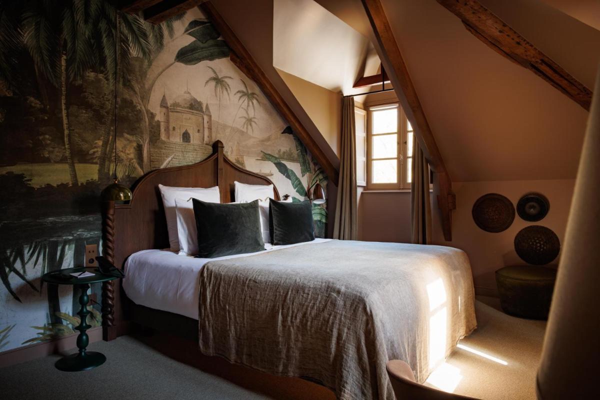 Un ou plusieurs lits dans un hébergement de l'établissement Domaine de Locguénolé & Spa - Relais & Chateaux