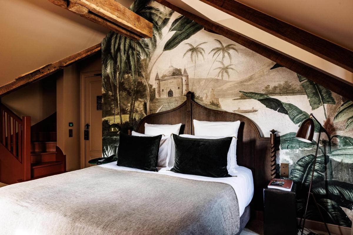 Un ou plusieurs lits dans un hébergement de l'établissement Domaine de Locguénolé & Spa - Relais & Chateaux