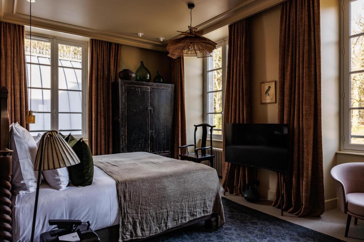 Un ou plusieurs lits dans un hébergement de l'établissement Domaine de Locguénolé & Spa - Relais & Chateaux