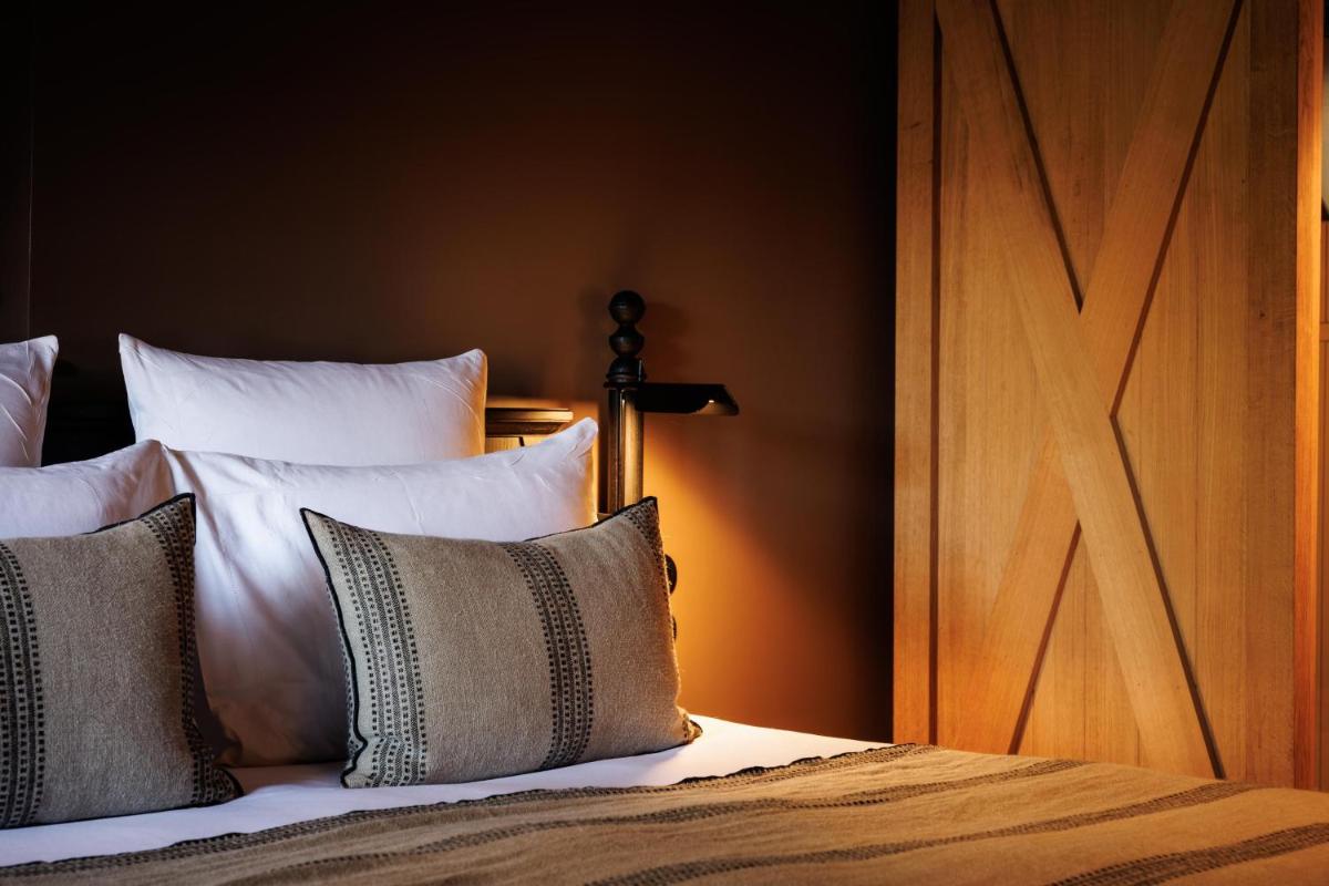 Un ou plusieurs lits dans un hébergement de l'établissement Domaine de Locguénolé & Spa - Relais & Chateaux