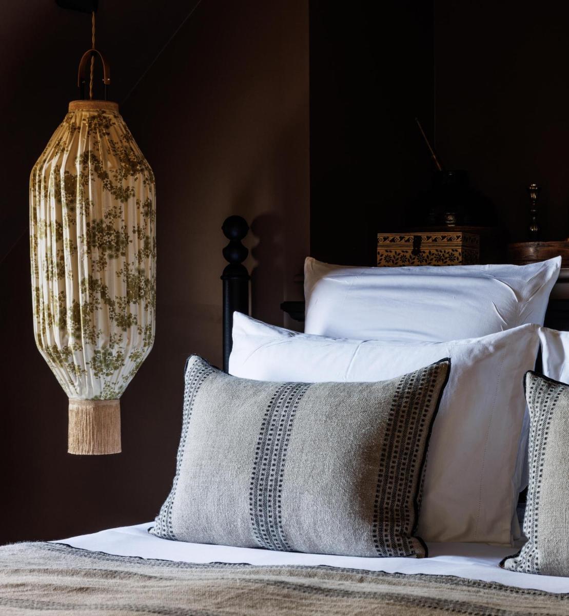 Un ou plusieurs lits dans un hébergement de l'établissement Domaine de Locguénolé & Spa - Relais & Chateaux