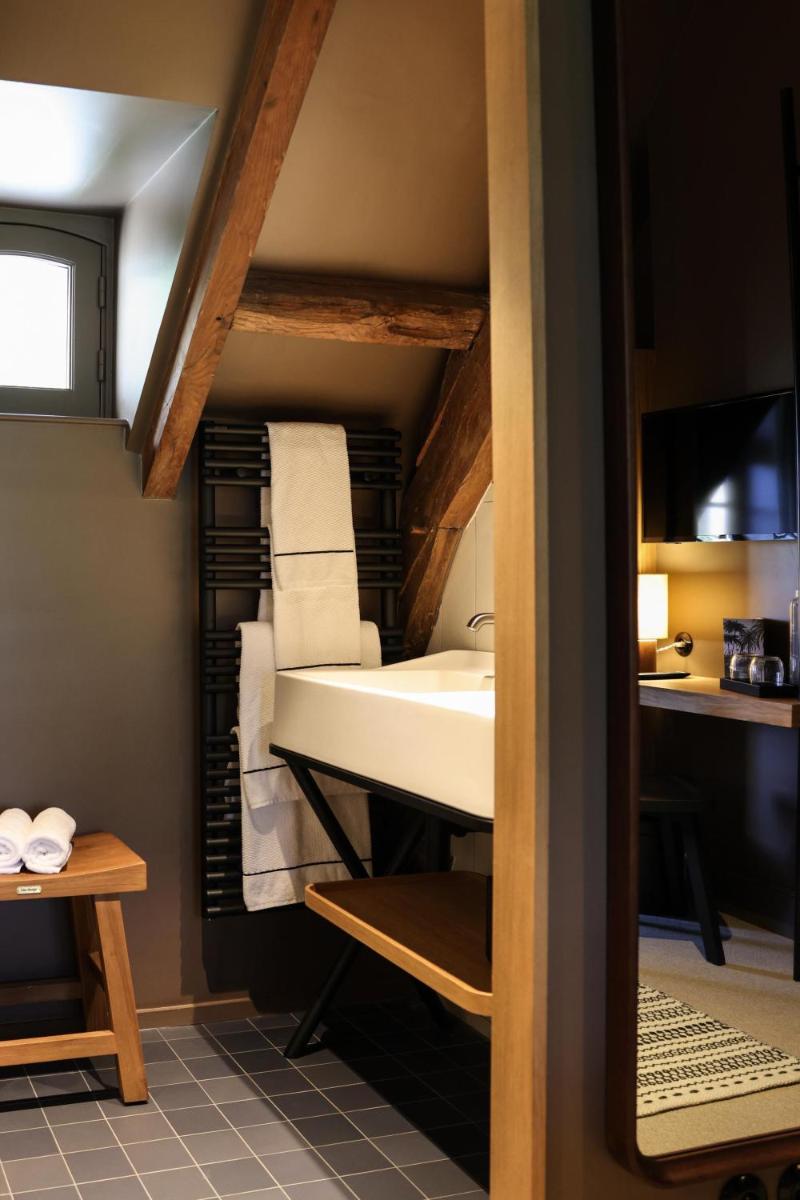 Un ou plusieurs lits dans un hébergement de l'établissement Domaine de Locguénolé & Spa - Relais & Chateaux