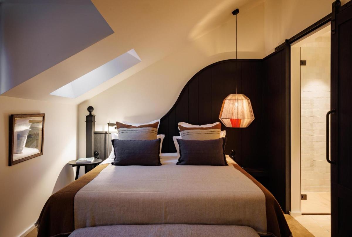 Un ou plusieurs lits dans un hébergement de l'établissement Domaine de Locguénolé & Spa - Relais & Chateaux