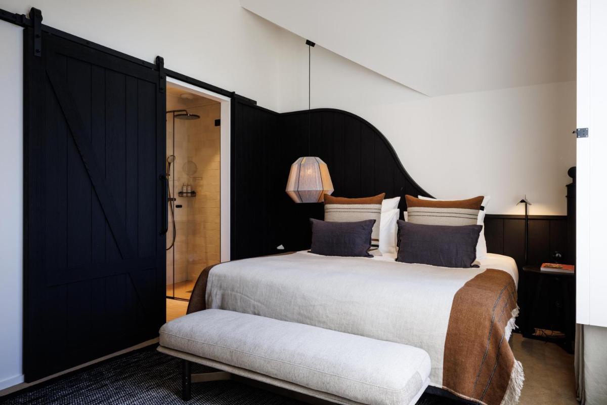 Un ou plusieurs lits dans un hébergement de l'établissement Domaine de Locguénolé & Spa - Relais & Chateaux