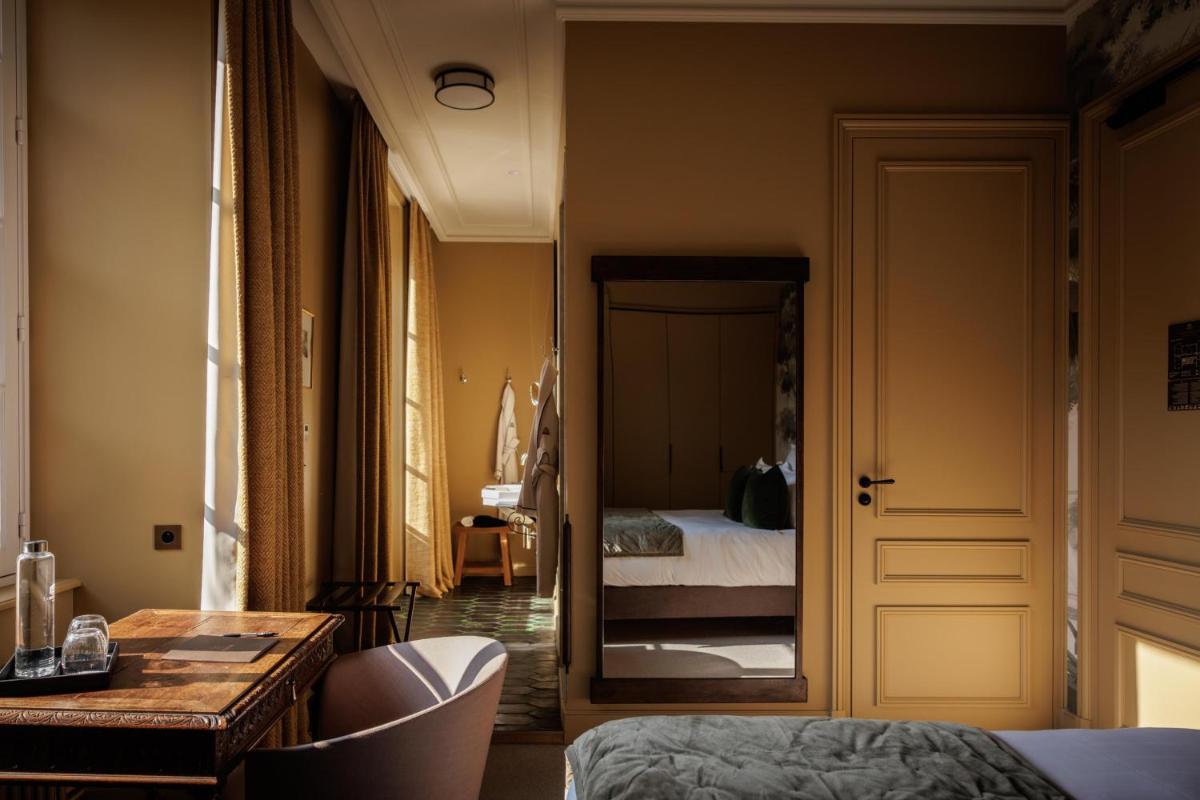 Un ou plusieurs lits dans un hébergement de l'établissement Domaine de Locguénolé & Spa - Relais & Chateaux