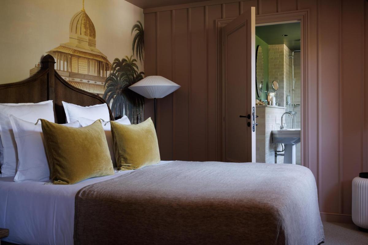 Un ou plusieurs lits dans un hébergement de l'établissement Domaine de Locguénolé & Spa - Relais & Chateaux