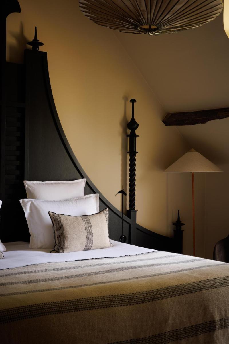 Un ou plusieurs lits dans un hébergement de l'établissement Domaine de Locguénolé & Spa - Relais & Chateaux