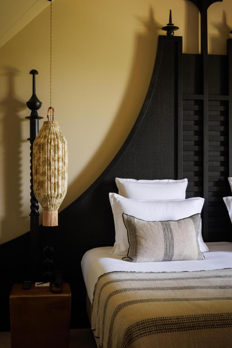 Un ou plusieurs lits dans un hébergement de l'établissement Domaine de Locguénolé & Spa - Relais & Chateaux