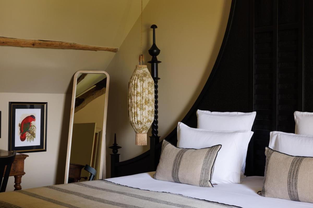 Un ou plusieurs lits dans un hébergement de l'établissement Domaine de Locguénolé & Spa - Relais & Chateaux