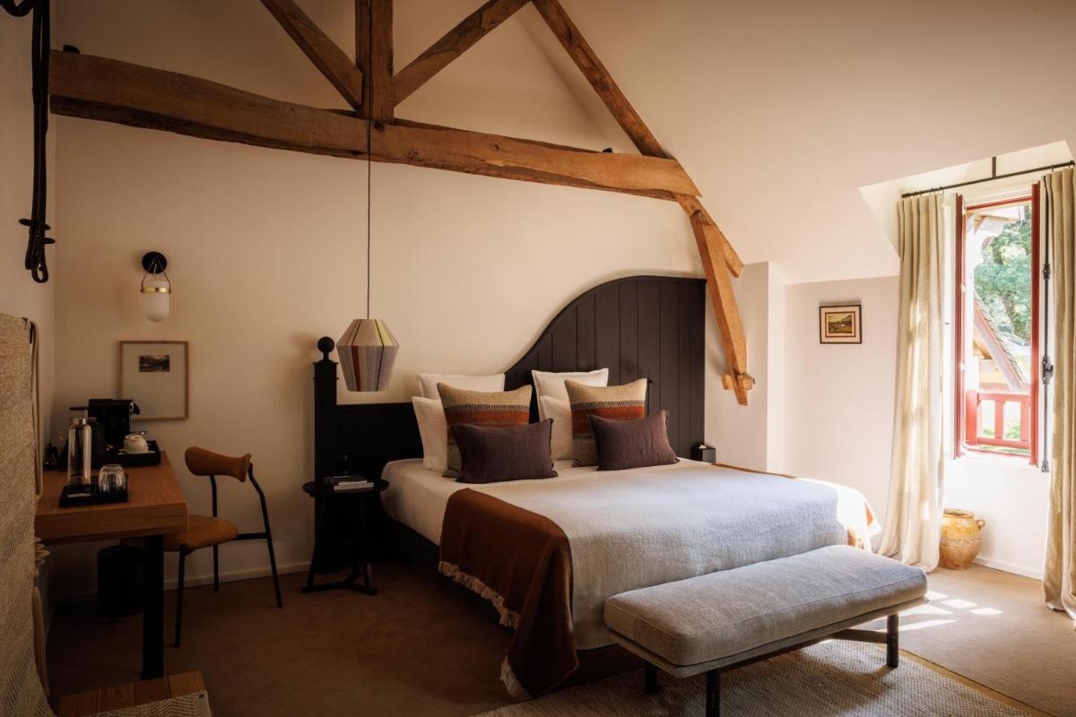 Un ou plusieurs lits dans un hébergement de l'établissement Domaine de Locguénolé & Spa - Relais & Chateaux