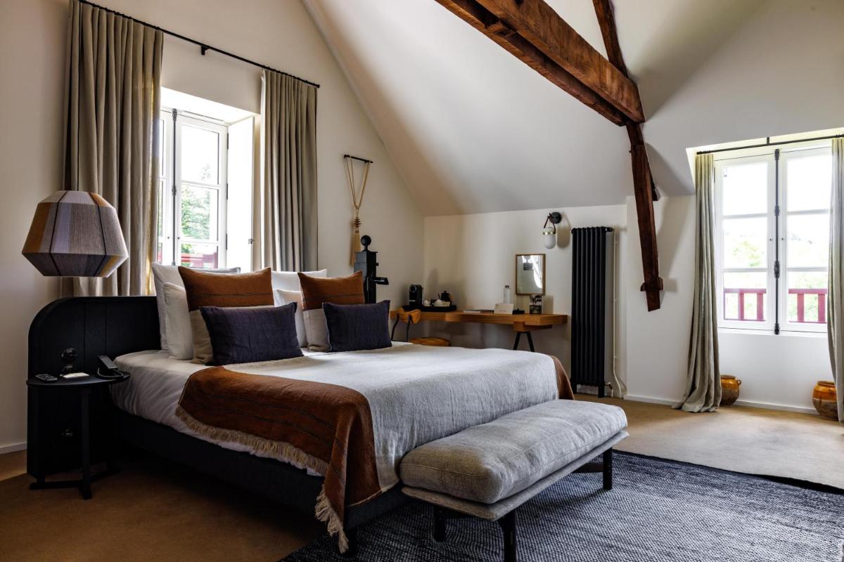 Un ou plusieurs lits dans un hébergement de l'établissement Domaine de Locguénolé & Spa - Relais & Chateaux