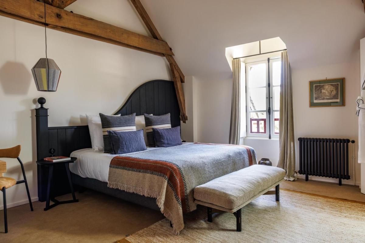 Un ou plusieurs lits dans un hébergement de l'établissement Domaine de Locguénolé & Spa - Relais & Chateaux