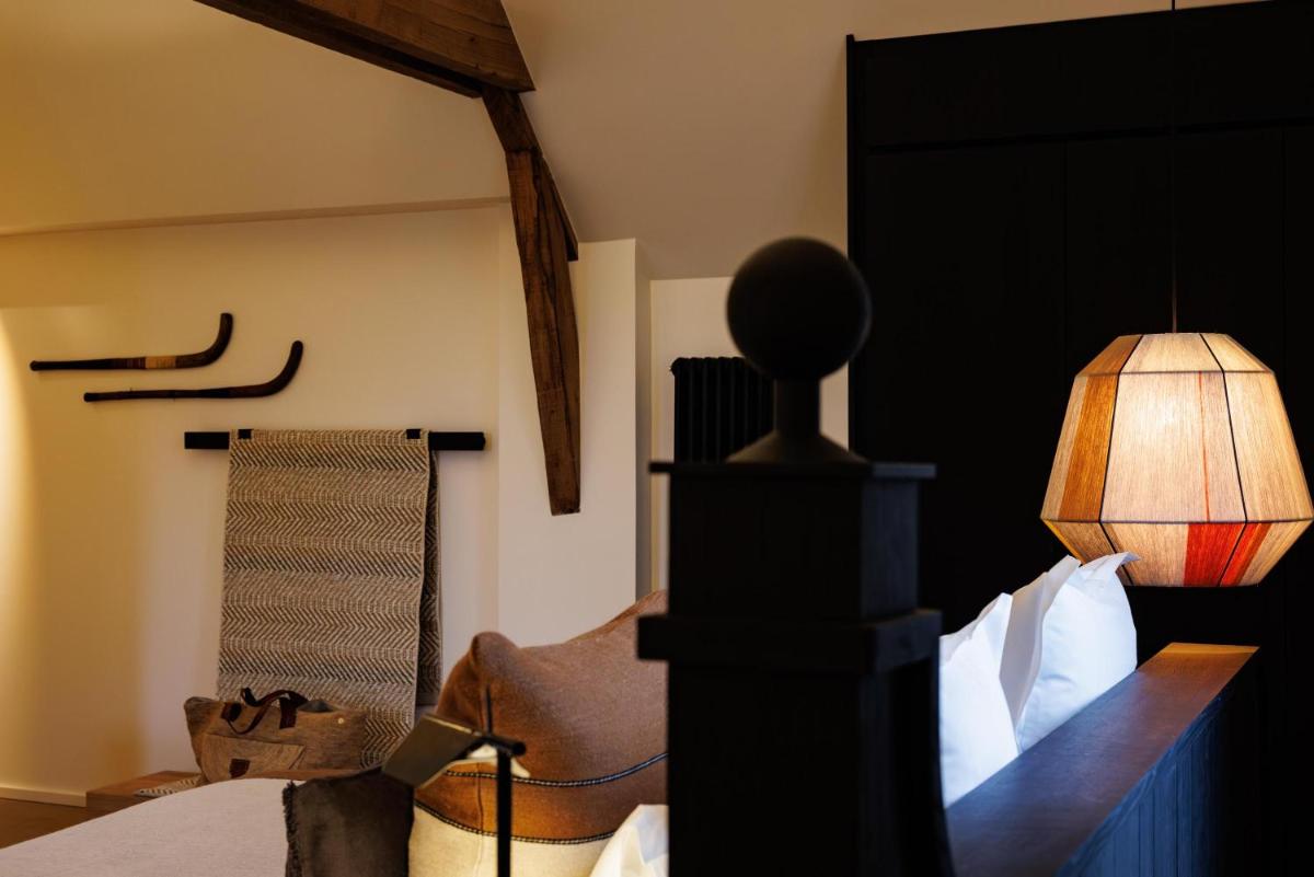 Un ou plusieurs lits dans un hébergement de l'établissement Domaine de Locguénolé & Spa - Relais & Chateaux