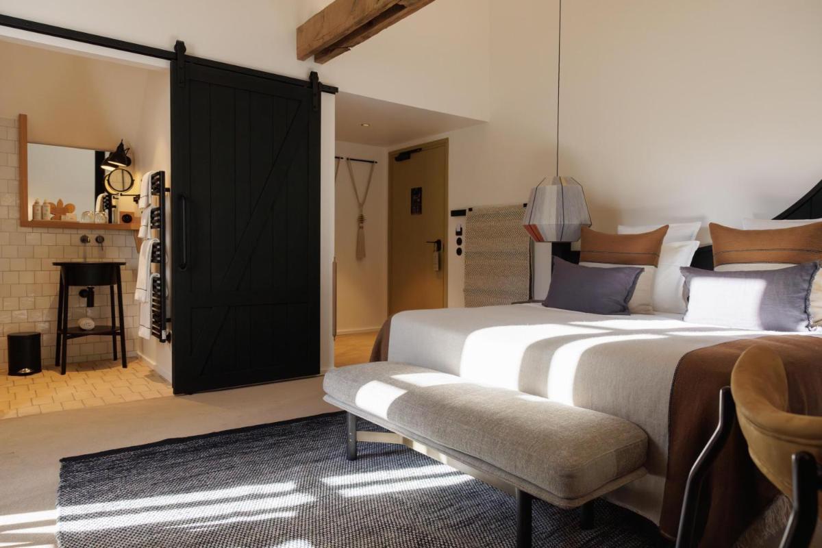 Un ou plusieurs lits dans un hébergement de l'établissement Domaine de Locguénolé & Spa - Relais & Chateaux
