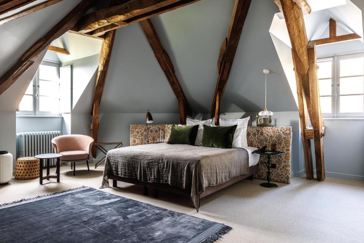 Un ou plusieurs lits dans un hébergement de l'établissement Domaine de Locguénolé & Spa - Relais & Chateaux