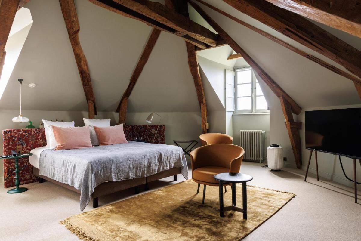 Un ou plusieurs lits dans un hébergement de l'établissement Domaine de Locguénolé & Spa - Relais & Chateaux