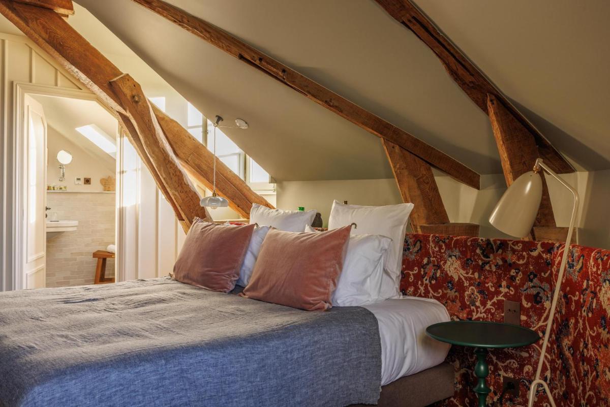 Un ou plusieurs lits dans un hébergement de l'établissement Domaine de Locguénolé & Spa - Relais & Chateaux