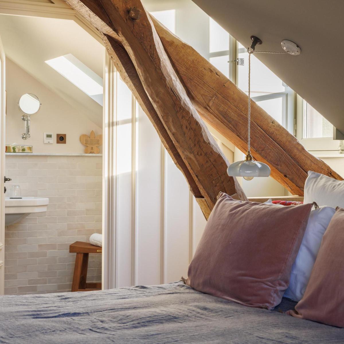 Un ou plusieurs lits dans un hébergement de l'établissement Domaine de Locguénolé & Spa - Relais & Chateaux