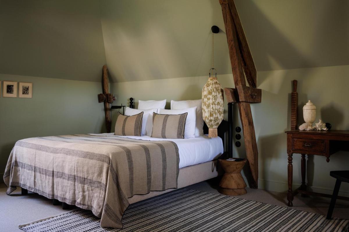 Un ou plusieurs lits dans un hébergement de l'établissement Domaine de Locguénolé & Spa - Relais & Chateaux