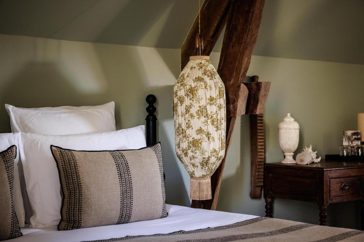 Un ou plusieurs lits dans un hébergement de l'établissement Domaine de Locguénolé & Spa - Relais & Chateaux
