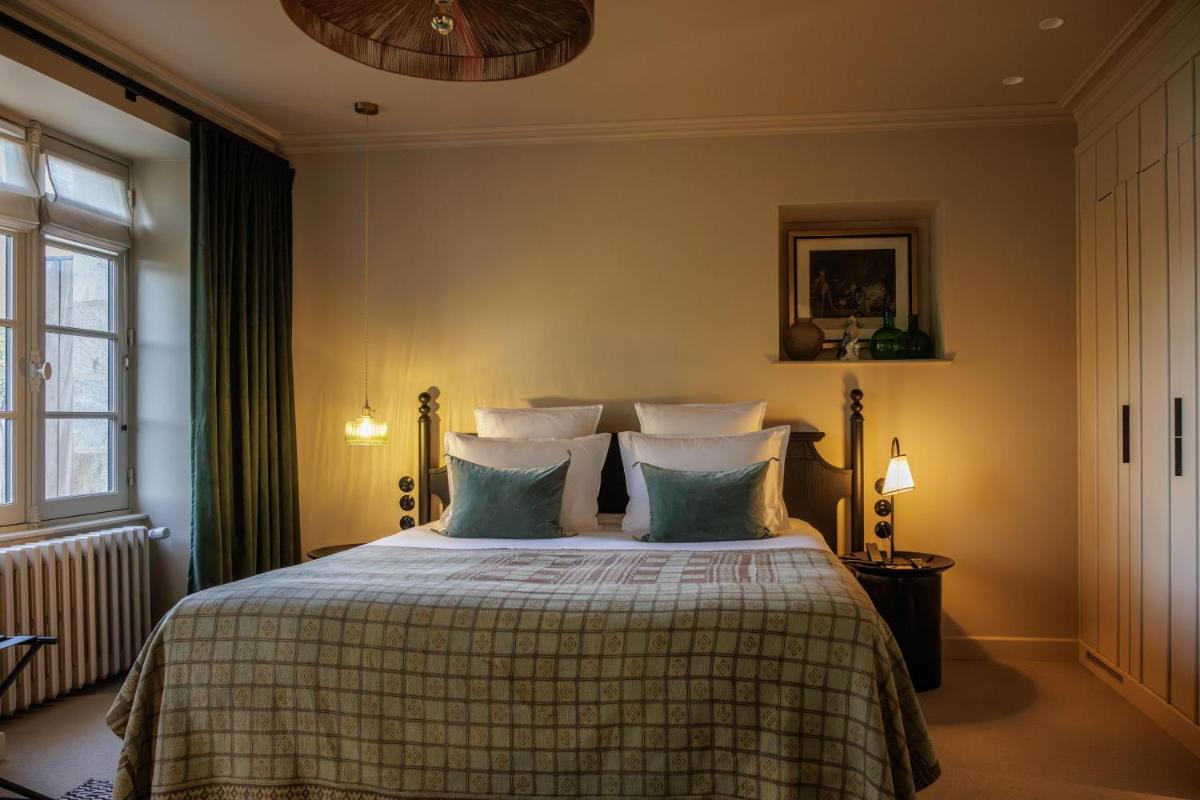 Un ou plusieurs lits dans un hébergement de l'établissement Domaine de Locguénolé & Spa - Relais & Chateaux