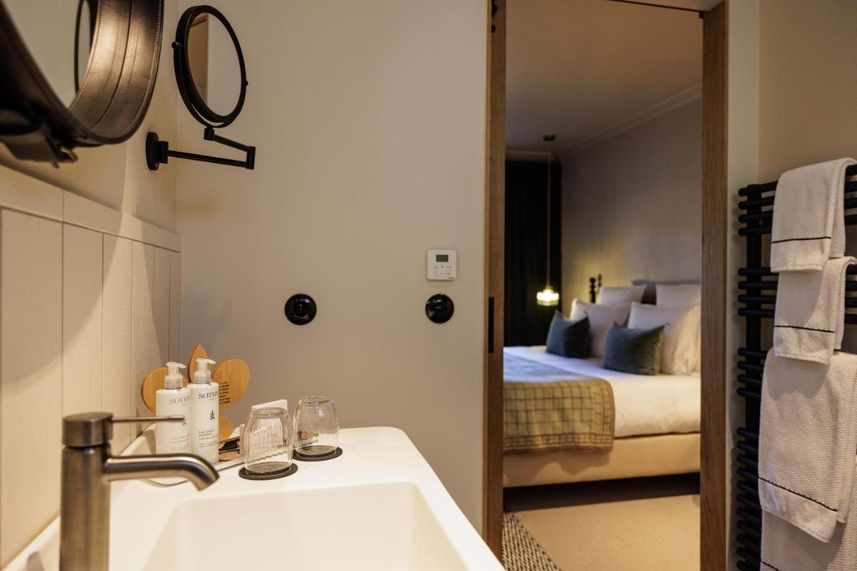 Un ou plusieurs lits dans un hébergement de l'établissement Domaine de Locguénolé & Spa - Relais & Chateaux