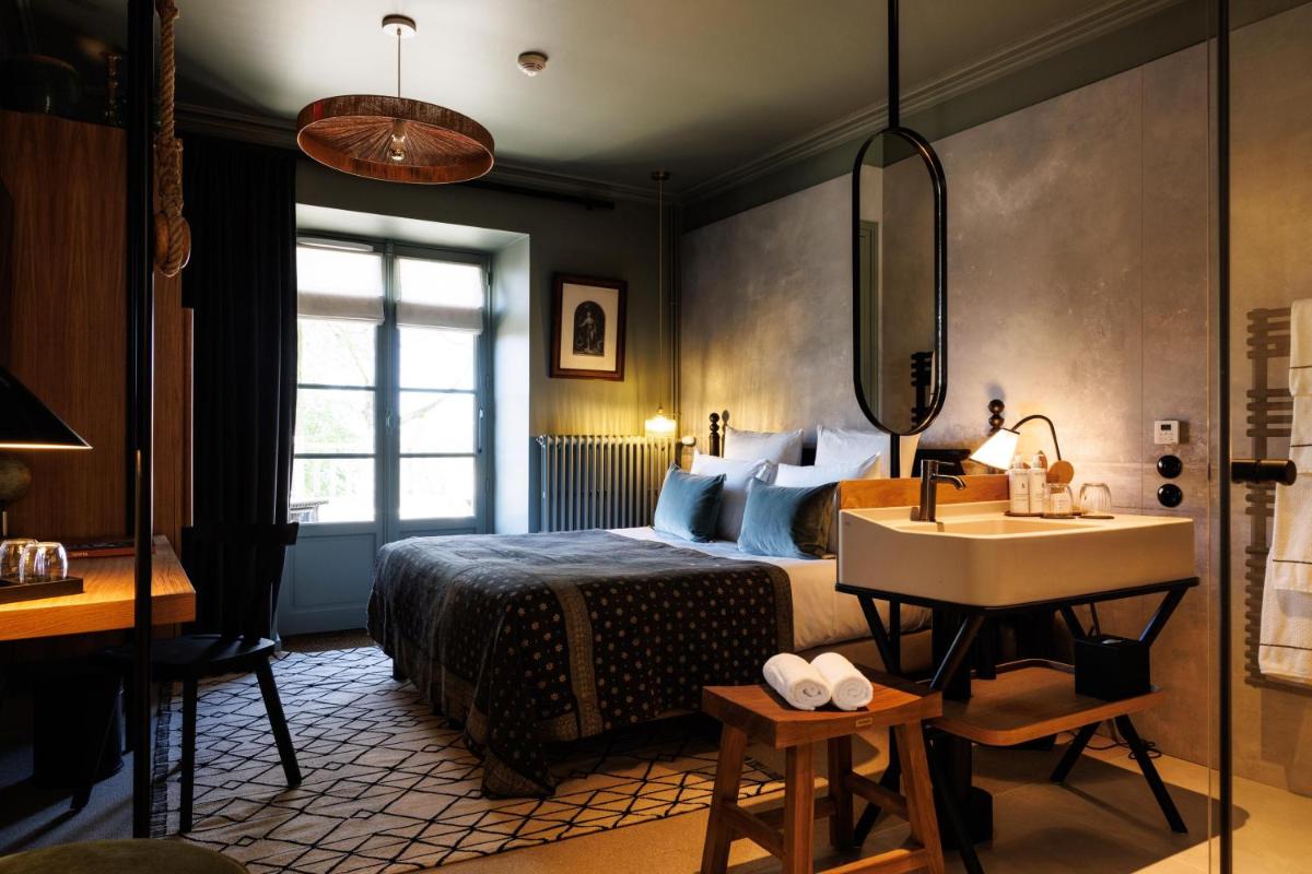 Un ou plusieurs lits dans un hébergement de l'établissement Domaine de Locguénolé & Spa - Relais & Chateaux