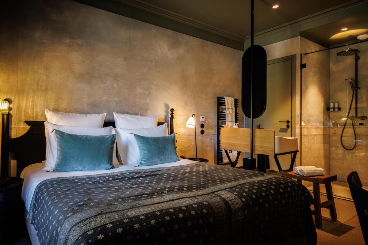 Un ou plusieurs lits dans un hébergement de l'établissement Domaine de Locguénolé & Spa - Relais & Chateaux