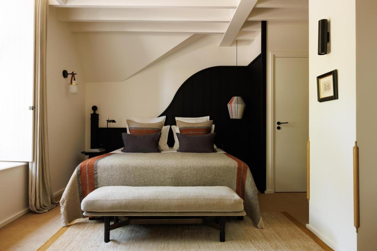 Un ou plusieurs lits dans un hébergement de l'établissement Domaine de Locguénolé & Spa - Relais & Chateaux