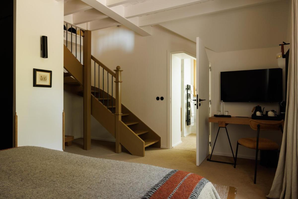 Télévision ou salle de divertissement dans l'établissement Domaine de Locguénolé & Spa - Relais & Chateaux