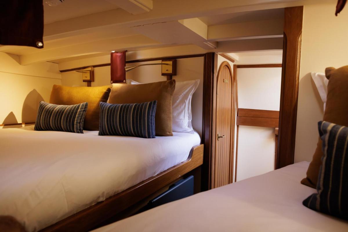 Un ou plusieurs lits dans un hébergement de l'établissement Domaine de Locguénolé & Spa - Relais & Chateaux