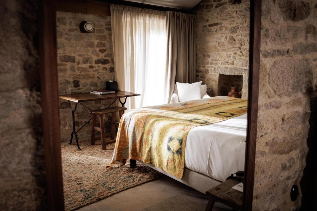 Un ou plusieurs lits dans un hébergement de l'établissement Domaine de Locguénolé & Spa - Relais & Chateaux