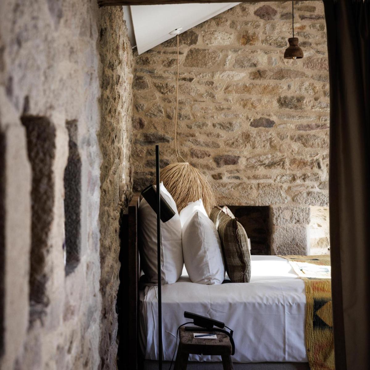 Un ou plusieurs lits dans un hébergement de l'établissement Domaine de Locguénolé & Spa - Relais & Chateaux