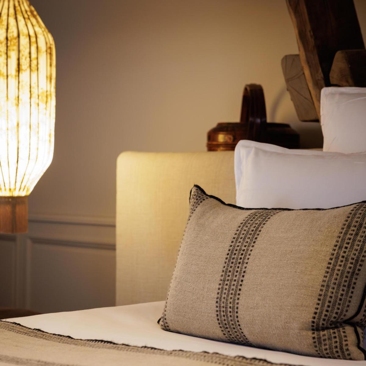 Un ou plusieurs lits dans un hébergement de l'établissement Domaine de Locguénolé & Spa - Relais & Chateaux