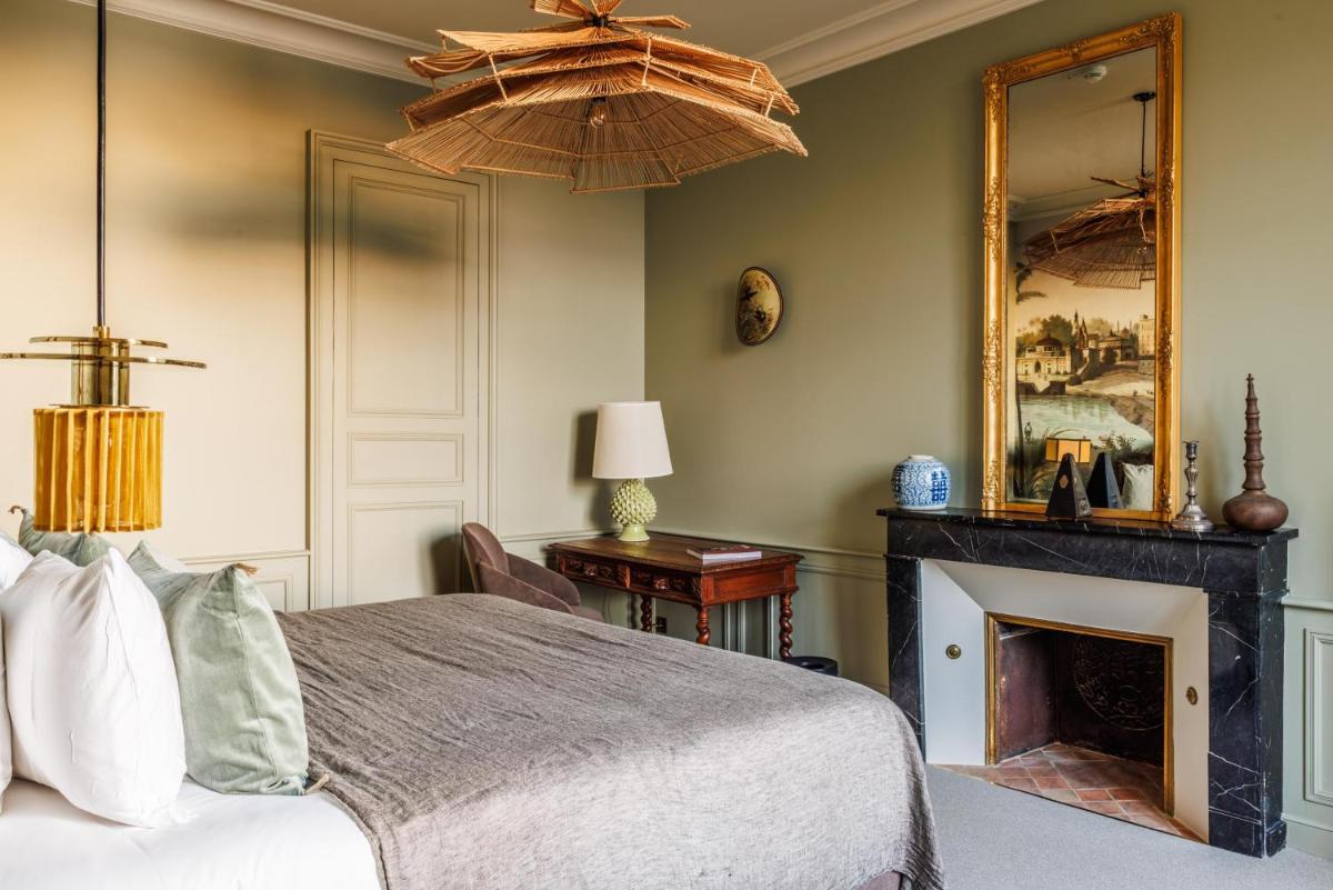 Un ou plusieurs lits dans un hébergement de l'établissement Domaine de Locguénolé & Spa - Relais & Chateaux